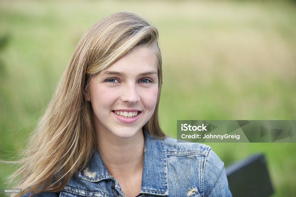 Smiling young woman Portrait of a pretty teenage girl outside smiling 14-15 Years Stock Photo