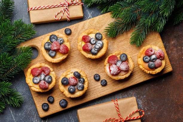 istock Festive delight: Christmas cupcakes adorned with berries 1830212279