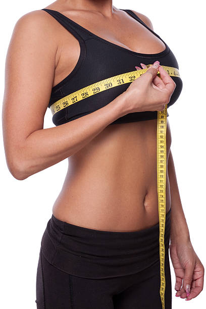 istock Beautiful woman is measuring her breast 183021297
