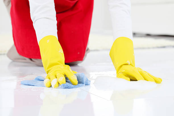 istock Lady in protective gloves cleaning a floors. 183021476