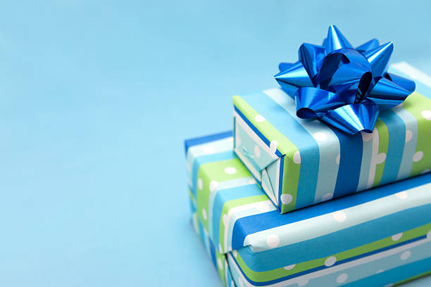 Blue gift box Blue gift boxes with blue ribbon. Copy-space and shallow DOF. birthday present stock pictures, royalty-free photos & images