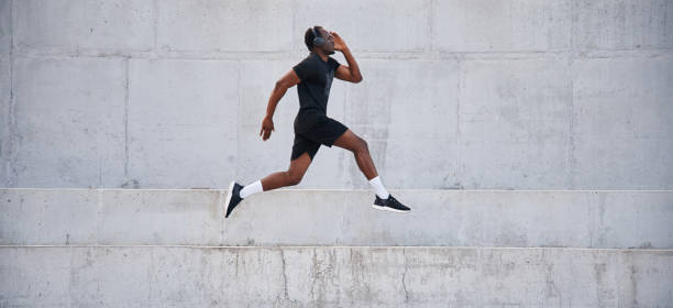istock Side view. Sportive black man is running, morning routine 1830220546