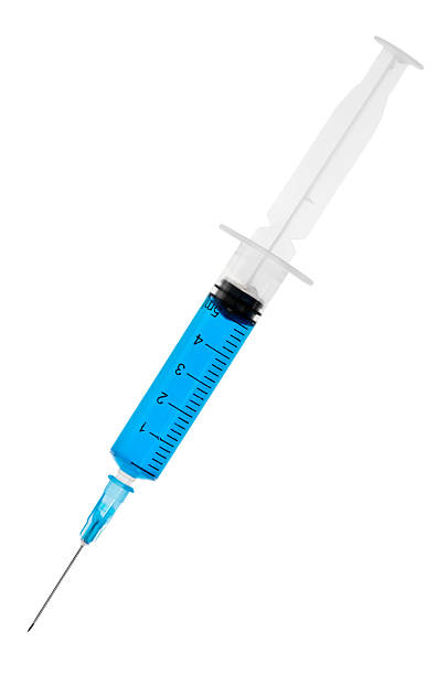 Syringe A single 5ml medical syringe or needle isolated on white. surgical needle stock pictures, royalty-free photos & images