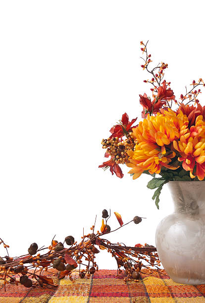 Autumn flowers in pots on window sill