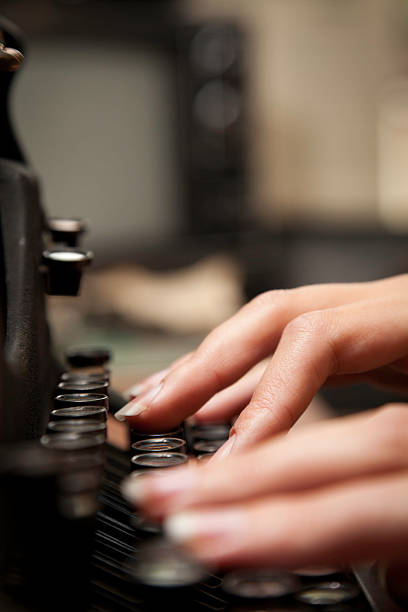 istock Closeup of Hands Typing on Old Fashioned Typewriter 183022955