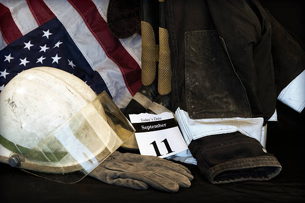 9-11 remembered with an American flag 9-11 remembered- this one ha a New York firefighter's outfit- grunge effect added usa flag shoes stock pictures, royalty-free photos & images