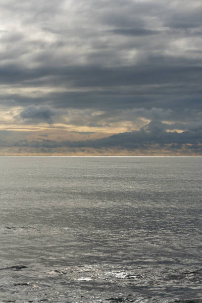 istock Thunderclouds over the sea. The approach of the storm. 1830231616