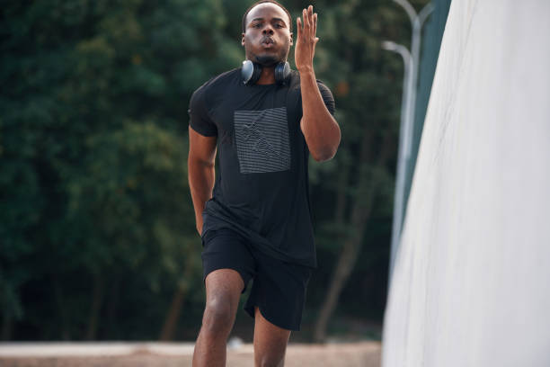 istock Active lifestyle. Sportive black man is running, morning routine 1830235339