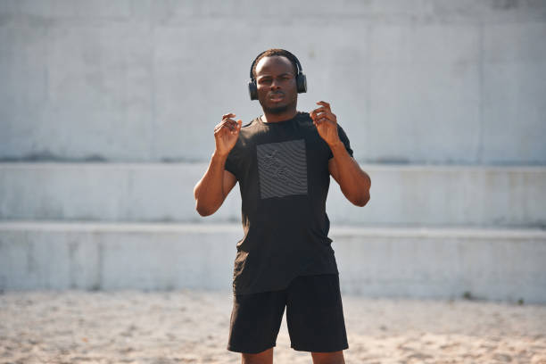 istock Handsome black man is posing outdoors at daytime 1830235875