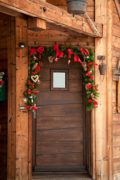 Wooden door christmas decorated.Many more skiing and winter holidays shots at:Snow Holidays Lightbox