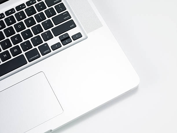 Laptop Detail Close up view of a laptop on table touchpad stock pictures, royalty-free photos & images