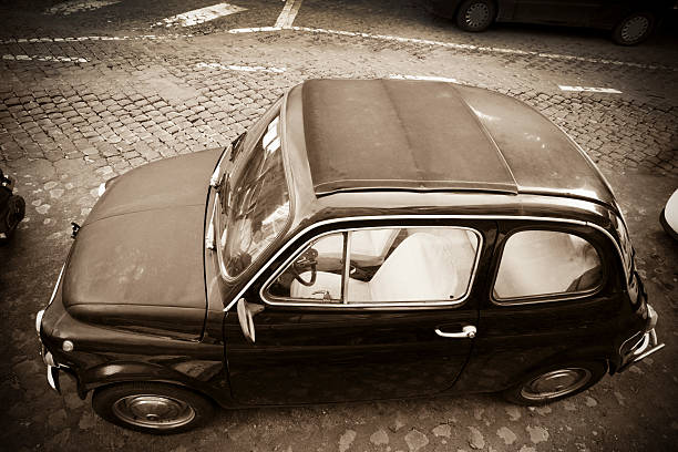 istock Tiny vintage car in Rome, Italy 183024217