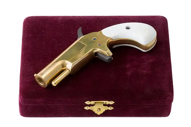 Photo of Brass derringer and carrying case