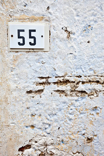 istock 55, Street Number On The Wall 183024500