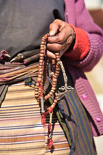 istock Nepali woman with rosary 183025415
