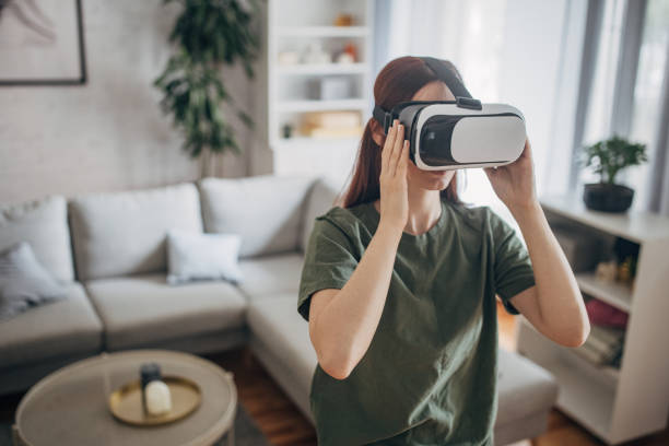 istock Woman wearing VR headset 1830255209