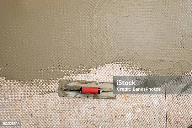 Trowel Resting On Bathroom Subfloor Stock Photo - Download Image Now - Preparation, Bathroom, Building - Activity