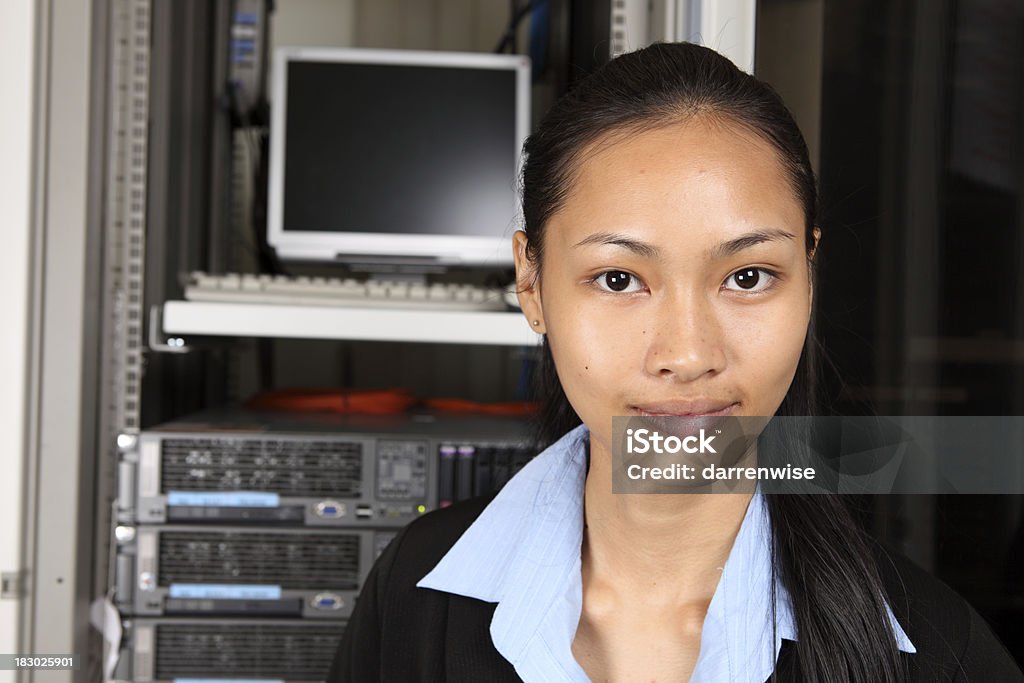 IT An IT worker in the server room. Adult Stock Photo