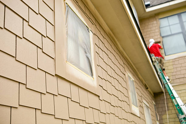 Black and yellow paint thrown on house facade.