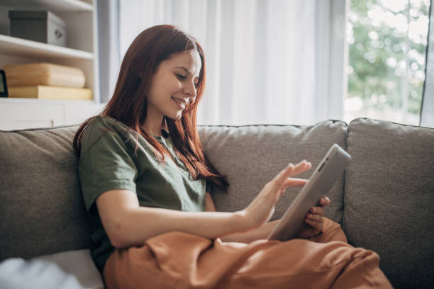 istock Woman relaxing on sofa 1830260326