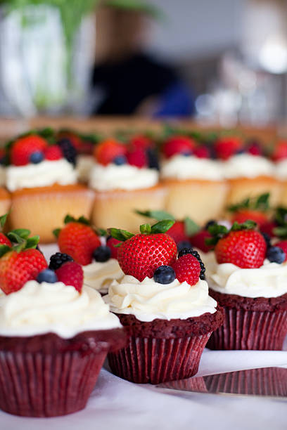 istock Fancy Red Velvet and Vanilla Cupcakes with Berries 183026226