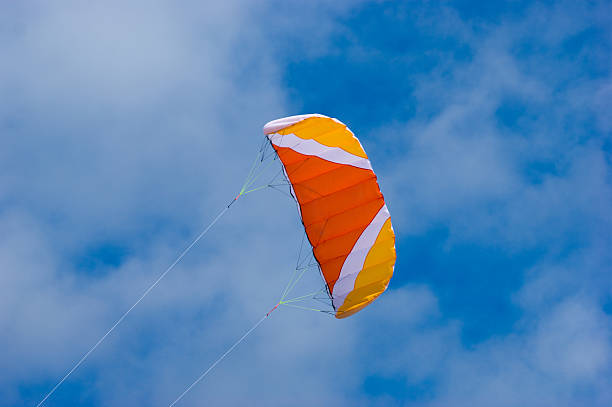 istock Orange yellow and white power kite 183026354