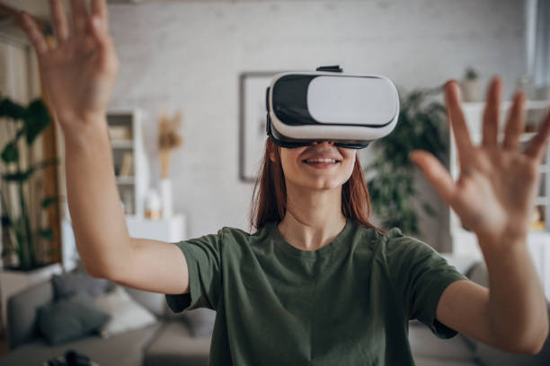 istock Woman having fun with VR headset 1830264917
