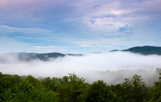 Fog and mist over Smoky Mountains at sunset
