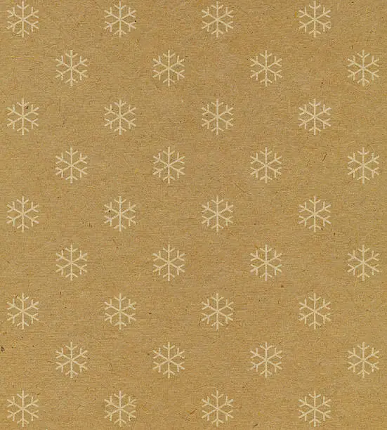 Photo of recycled paper with snowflake pattern