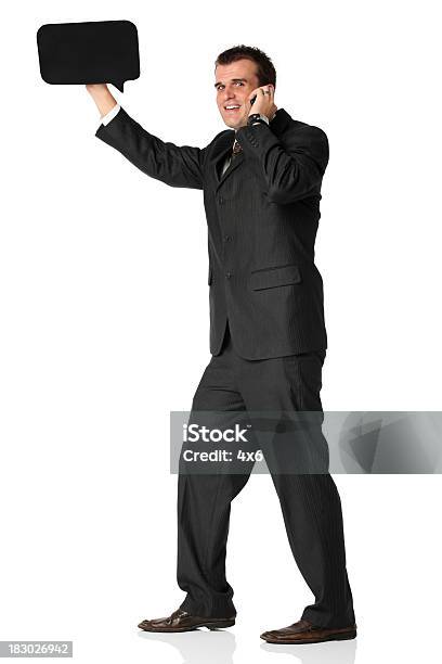 Businessman Holding A Speech Bubble And Talking Stock Photo - Download Image Now - Adult, Adults Only, Announcement Message