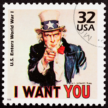 Canceled vintage American stamp of Uncle Sam used in military recruitment campaign.