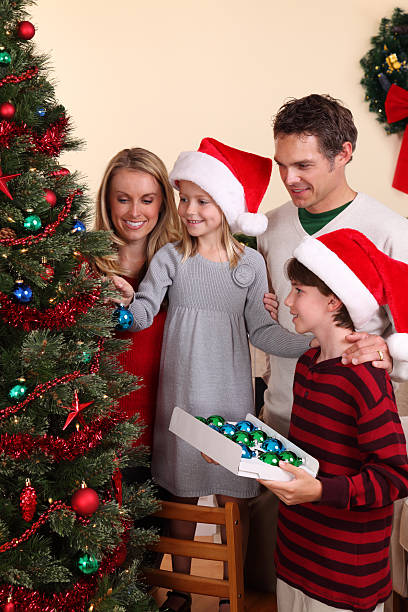 istock Family Decorating For The Holidays 183027580
