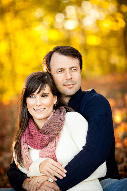 istock Happy Couple Sitting Together in the Woods During Autumn 183027770