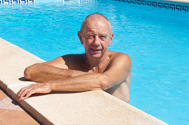 istock senior male in swimming pool 183028030