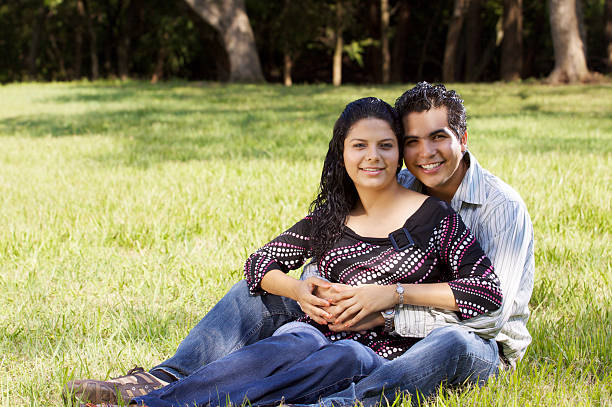 Happy couple at park stock photo