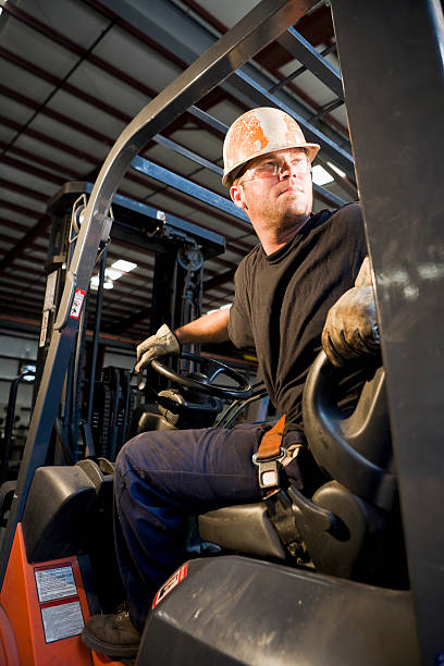 istock Male worker operating forklift in warehouse 183028750