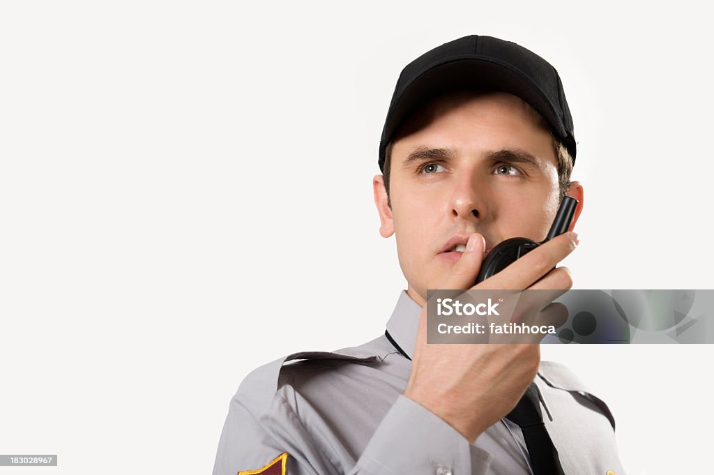 Security Guard Security guard is talking with walkie talkie in his hand. Security Guard Stock Photo