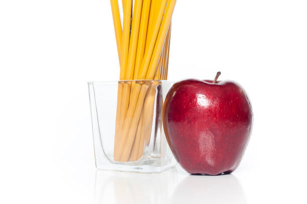 Pencils and Apple stock photo