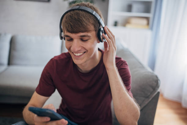 istock Man listening music at home 1830291584
