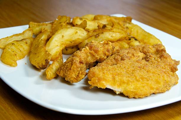 istock Chicken Tenders and Potato Wedges 183029232