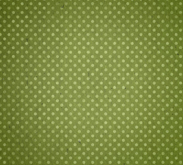 istock faded green paper with polka dots 183030179