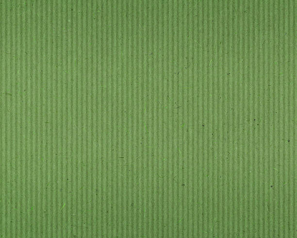 green textured paper with vertical lines stock photo