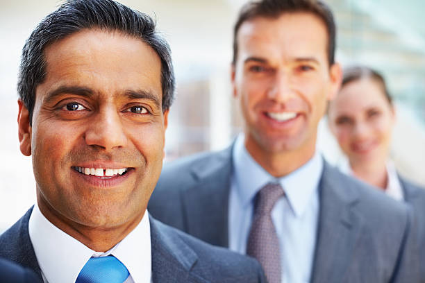 istock Business executive with colleagues in the background 183030435
