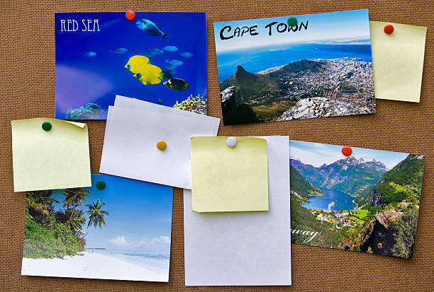 Pinboard A typical pinboard with several postcards and some papers left blank.All postcards are my own photographies. bulletin board photos stock pictures, royalty-free photos & images