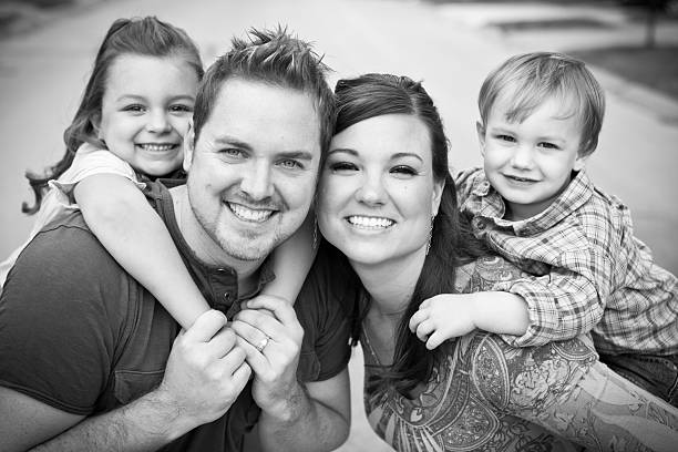 istock Happy Young Family Smiling Together Outside 183030681
