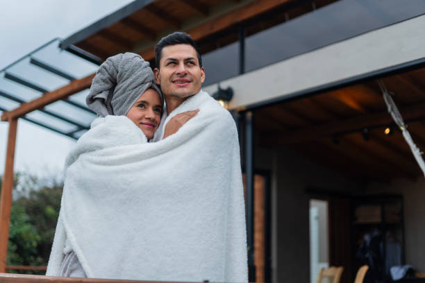 istock Couple enjoys a weekend while in their cabin using their blanket 1830307343