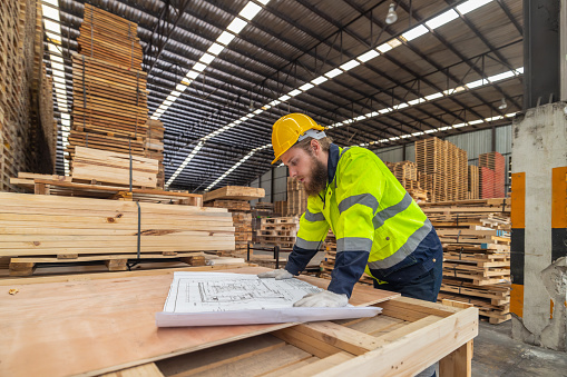 Woodworkers assess blueprints, select low-carbon materials, follow schemes for eco-friendly production. Quality, environmental responsibility are reflected in precise assembly, meeting high standards