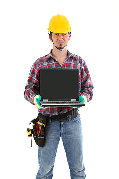Trabalhador da Construção Civil simpática & computador portátil - fotografia de stock