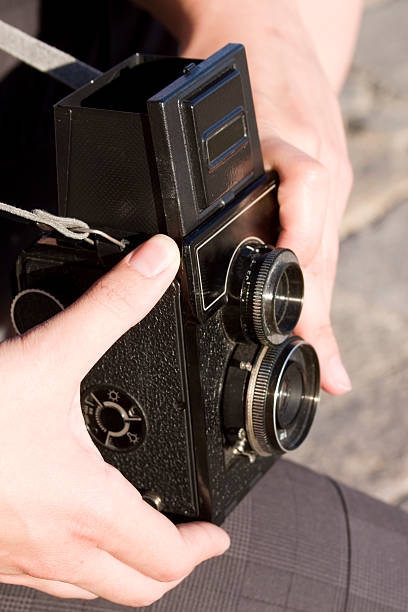 istock Photographing with old-fashinoned camera 183031289