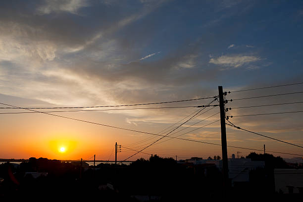 istock Power and telephone lines against a colourful sunset 183031333